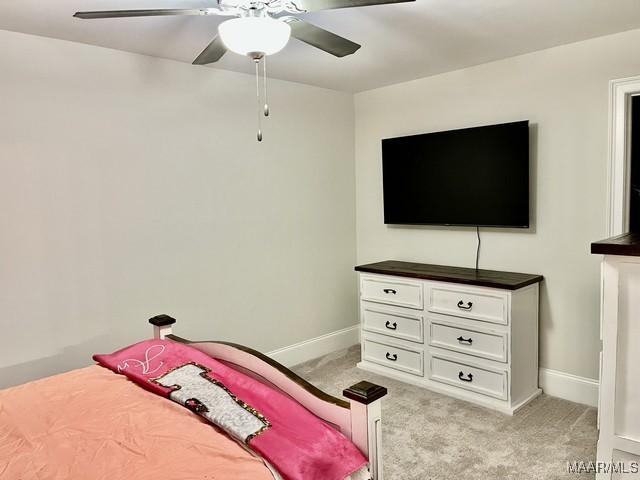 carpeted bedroom featuring ceiling fan