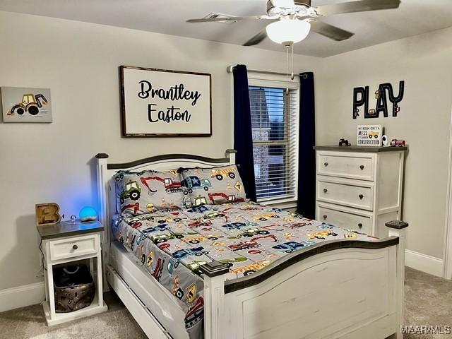 bedroom with ceiling fan and carpet flooring