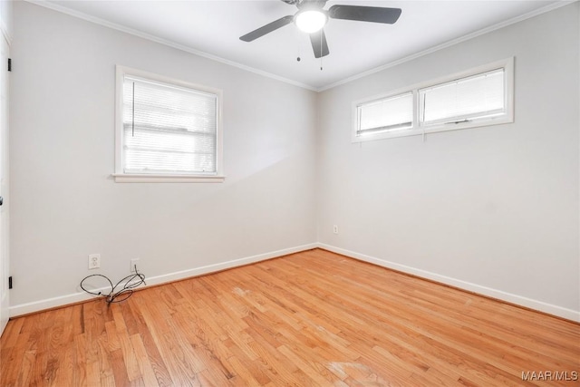 spare room with crown molding, ceiling fan, and light hardwood / wood-style floors