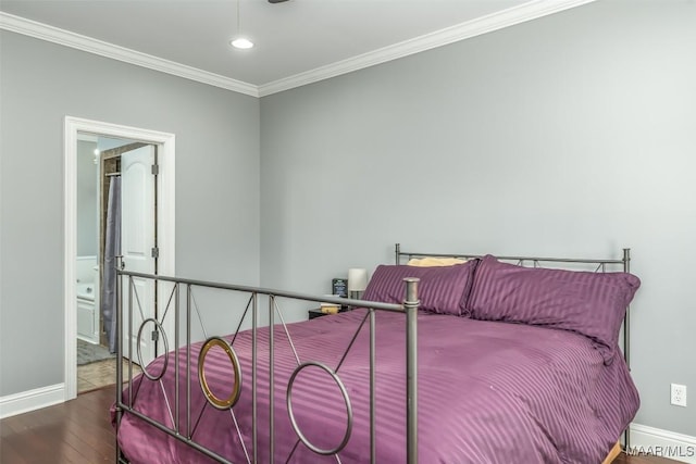 bedroom with ornamental molding, wood-type flooring, and ensuite bath