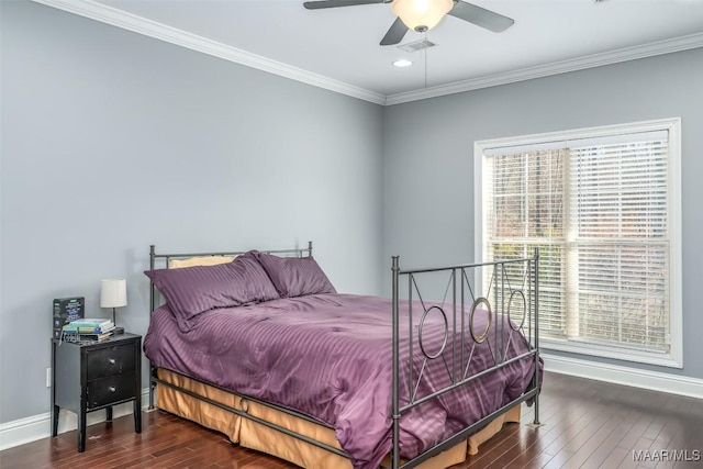 bedroom featuring ceiling fan, ornamental molding, and dark hardwood / wood-style floors