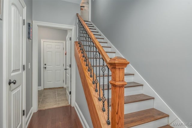 stairway with wood-type flooring