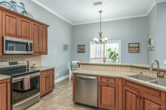 kitchen with stainless steel appliances, crown molding, sink, and decorative backsplash