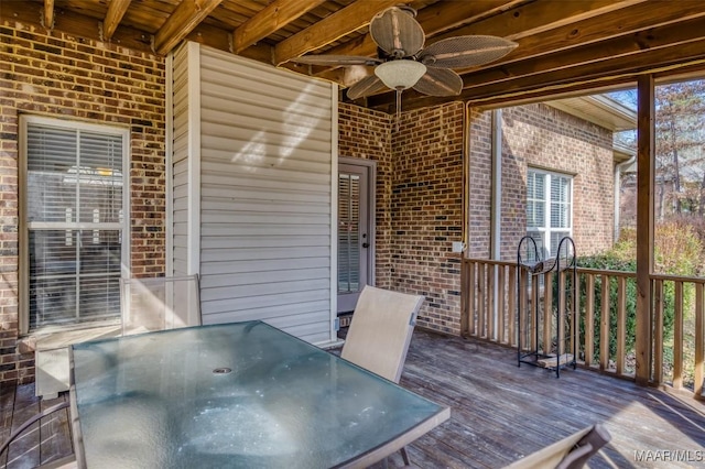 wooden terrace featuring ceiling fan