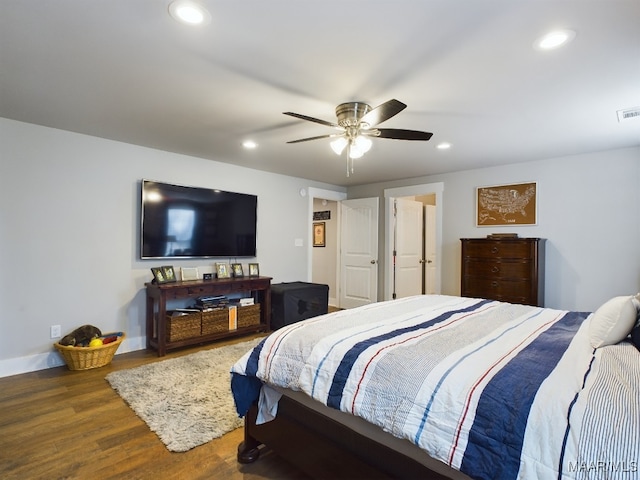 bedroom with dark wood-type flooring and ceiling fan