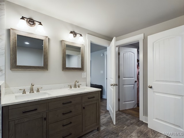 bathroom featuring wood-type flooring and vanity