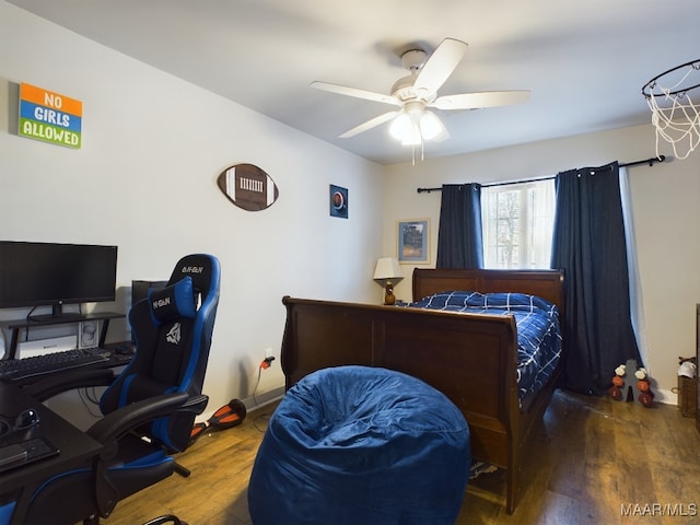 bedroom with ceiling fan and dark hardwood / wood-style flooring