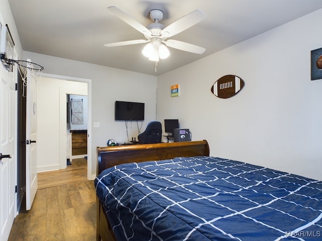 bedroom with hardwood / wood-style flooring and ceiling fan