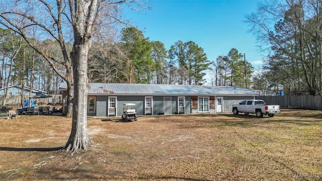 ranch-style house with a front yard