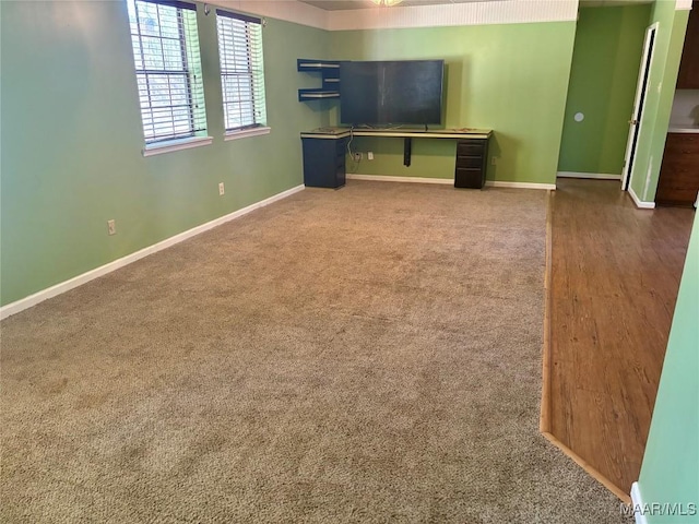 unfurnished living room with carpet flooring