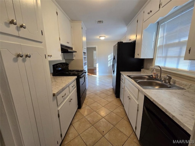 kitchen featuring light tile patterned floors, visible vents, a sink, under cabinet range hood, and black appliances