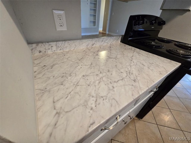 kitchen with light tile patterned flooring