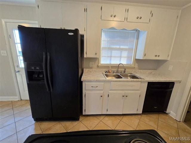 kitchen featuring white cabinetry, a sink, black appliances, and light tile patterned floors