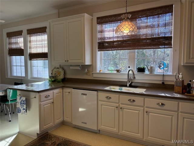 kitchen featuring sink, white cabinetry, hanging light fixtures, white dishwasher, and kitchen peninsula