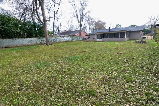 view of yard with a sunroom