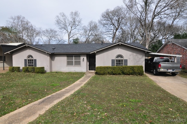 ranch-style house with a carport and a front lawn