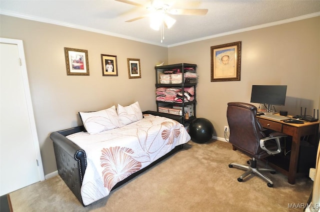 carpeted bedroom with ornamental molding and ceiling fan