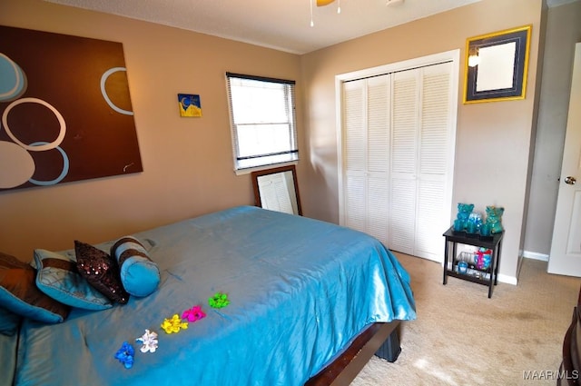 carpeted bedroom with a closet