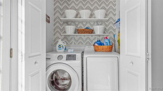 laundry room with washing machine and clothes dryer