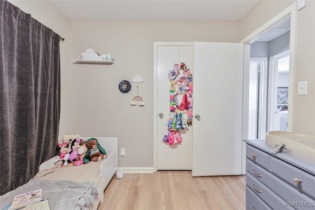 bedroom featuring light wood-type flooring