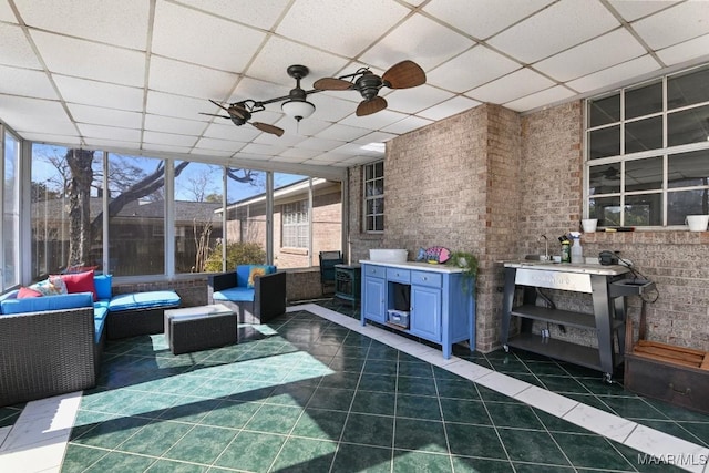 view of patio featuring ceiling fan, an outdoor living space, and exterior bar