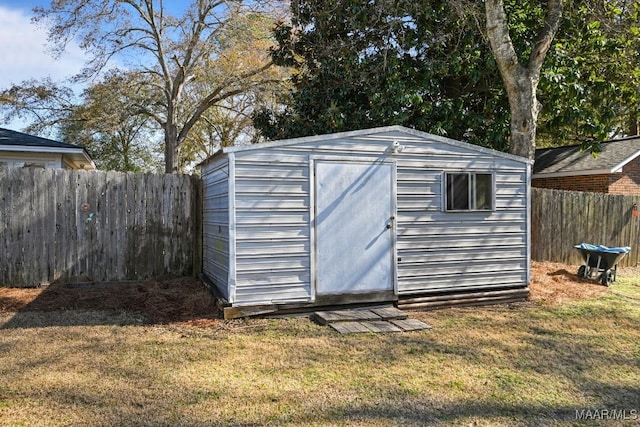 view of outbuilding with a lawn