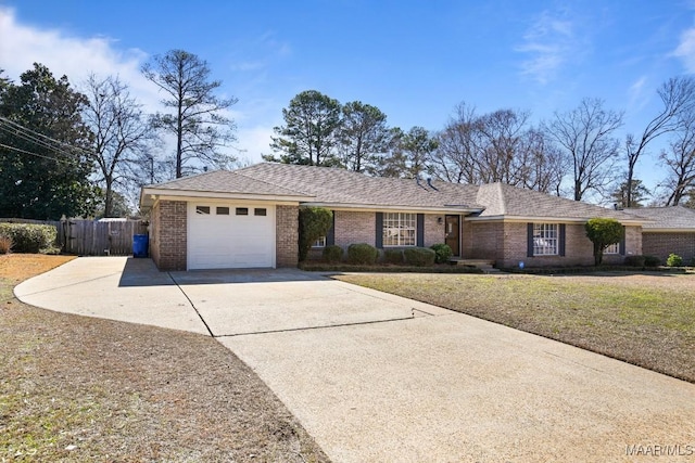 single story home featuring a garage and a front lawn