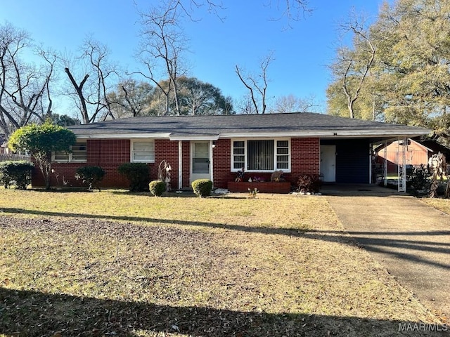 ranch-style home with a front yard and a carport