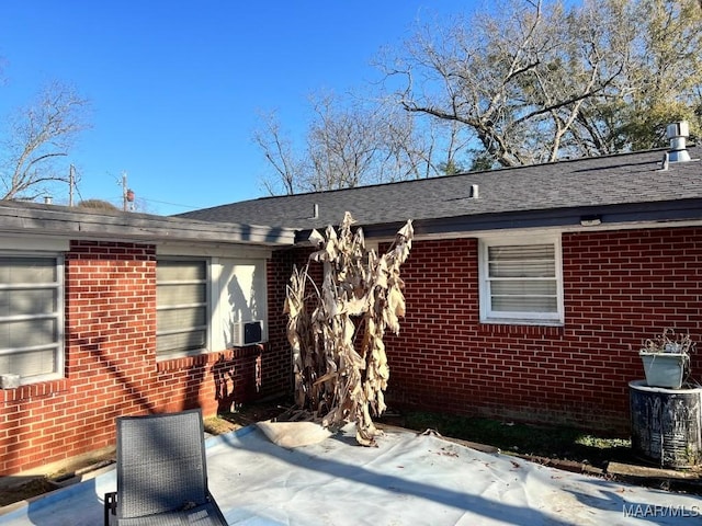 property entrance featuring a patio area