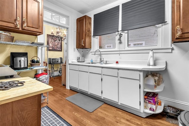 kitchen with sink and light hardwood / wood-style floors