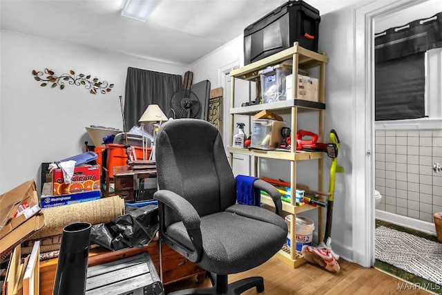 office area featuring tile walls and wood-type flooring