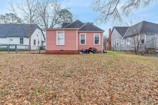 view of side of home featuring a yard