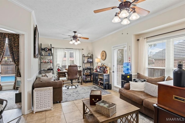 tiled living room featuring ceiling fan, crown molding, and a textured ceiling