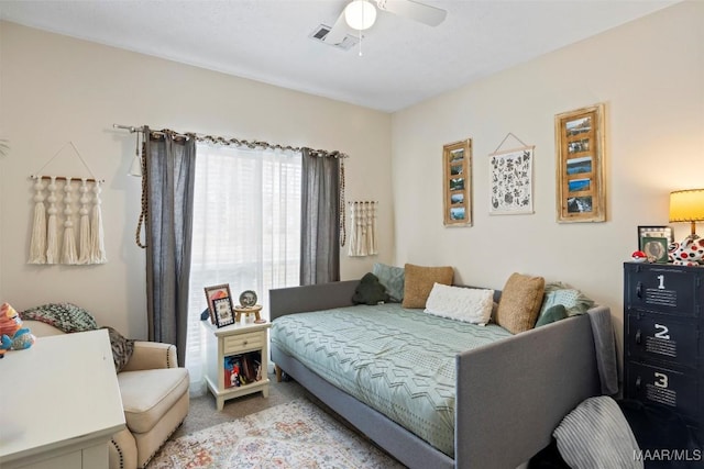 bedroom with light colored carpet and ceiling fan