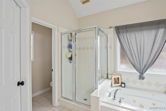 bathroom featuring lofted ceiling, toilet, independent shower and bath, and tile patterned flooring