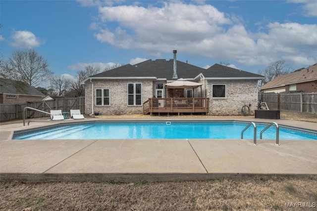 view of swimming pool with a deck