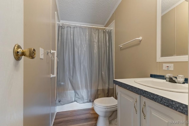 full bathroom featuring shower / bathtub combination with curtain, vanity, ornamental molding, a textured ceiling, and toilet