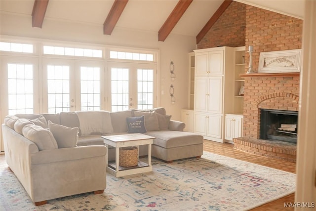 living room with vaulted ceiling with beams and a brick fireplace