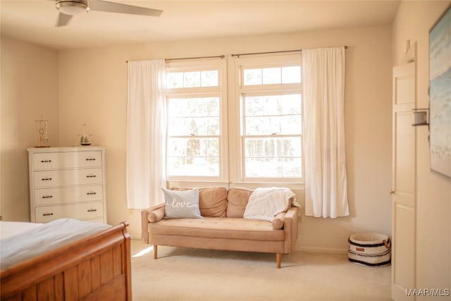 bedroom featuring light carpet and ceiling fan