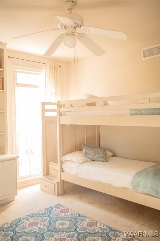 bedroom featuring ceiling fan and carpet flooring