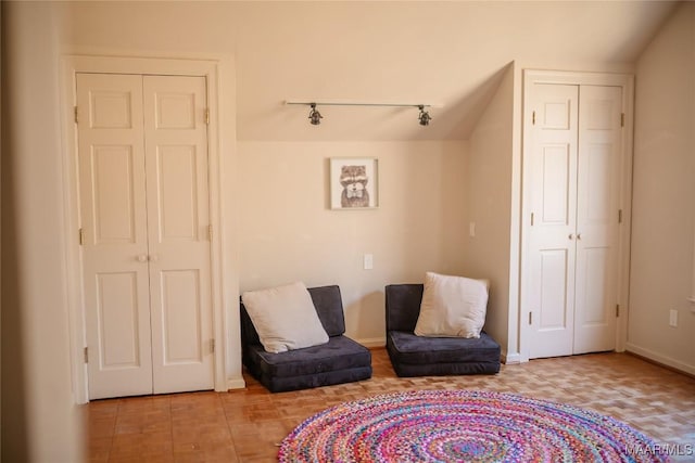 living area featuring track lighting