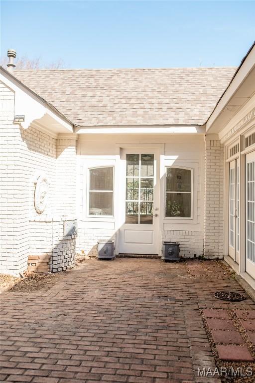 entrance to property with a patio