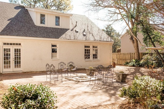 rear view of property featuring a patio and french doors