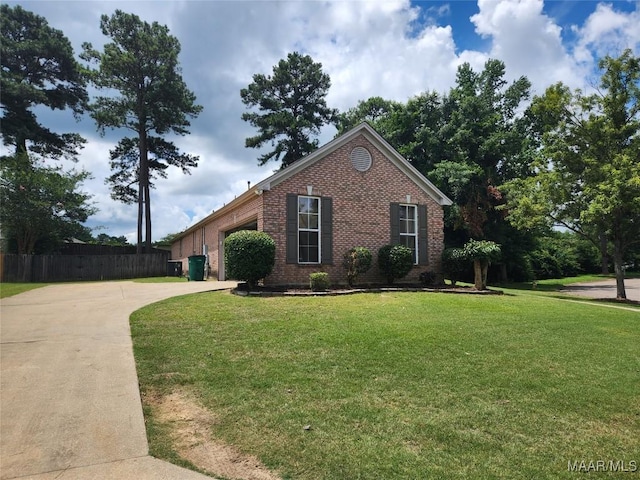 view of front of home with a garage and a front yard