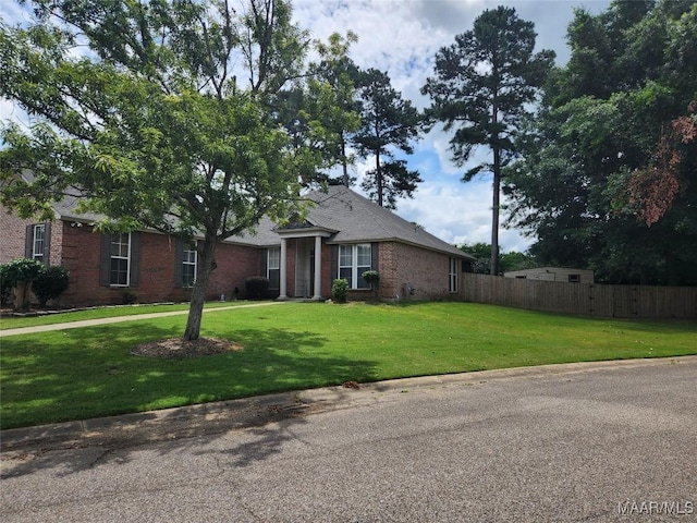 ranch-style home with a front lawn