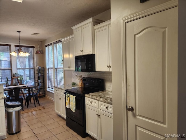 kitchen with white cabinetry, light stone countertops, decorative backsplash, and black appliances