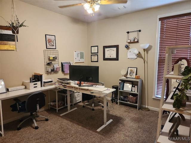 carpeted office space with ceiling fan