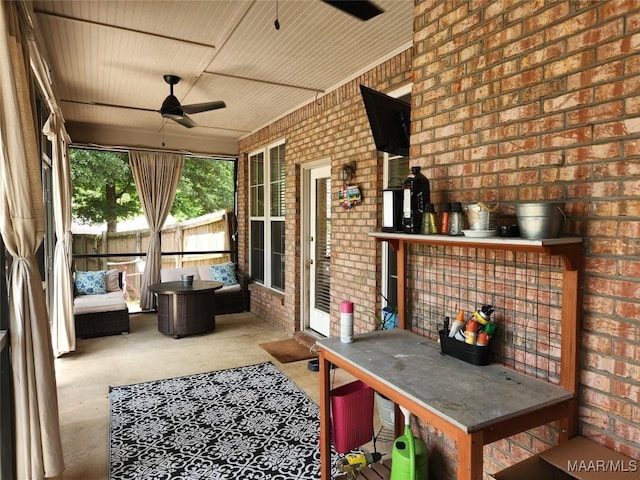 sunroom / solarium with ceiling fan