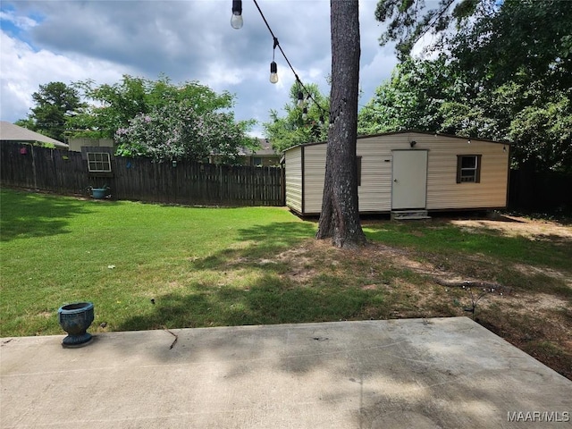 view of yard featuring a storage shed and a patio