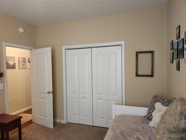 bedroom with carpet floors and a closet